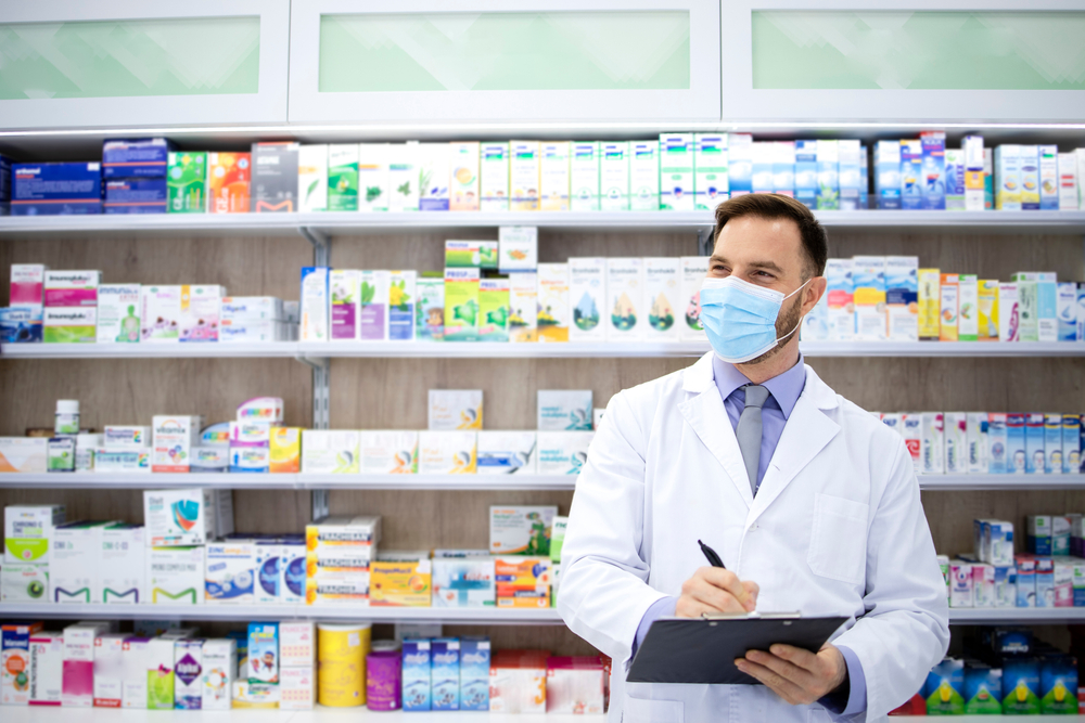 smiling pharmacist with clipboard