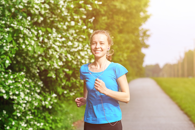 woman running along trail