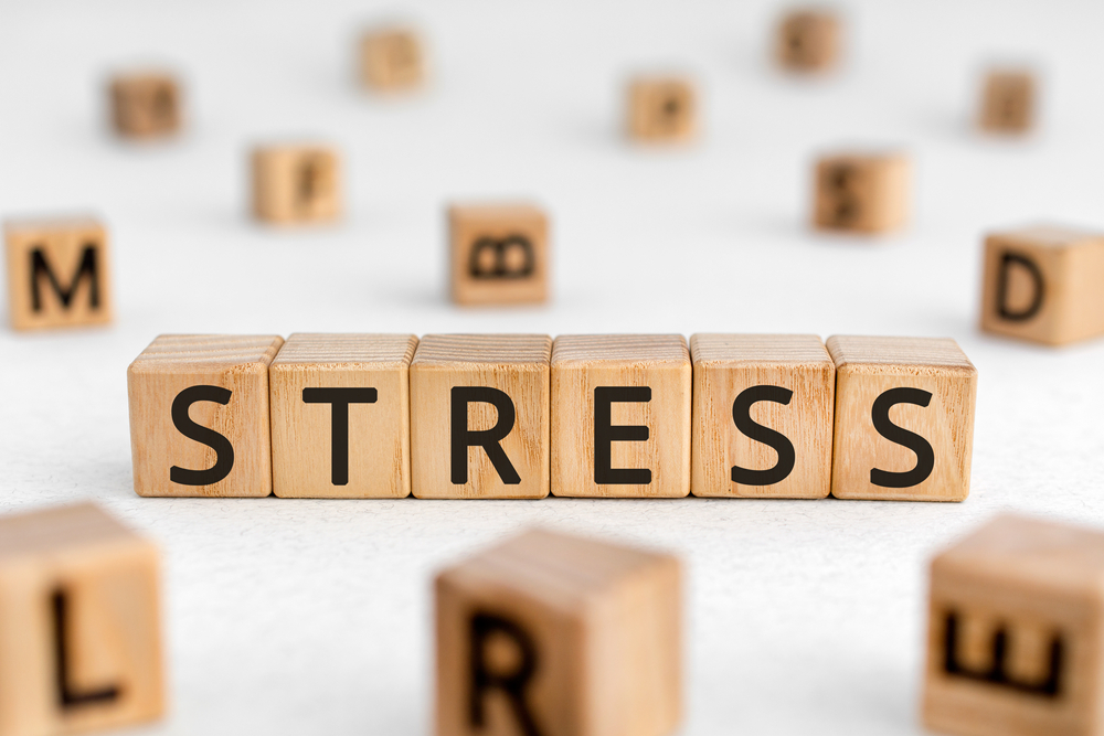 stress spelled out in wooden blocks
