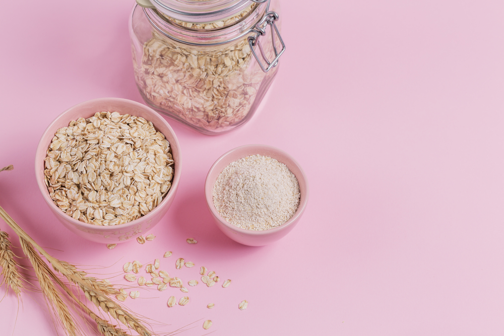 bowl of  whole oats next to bowl of finely ground oats