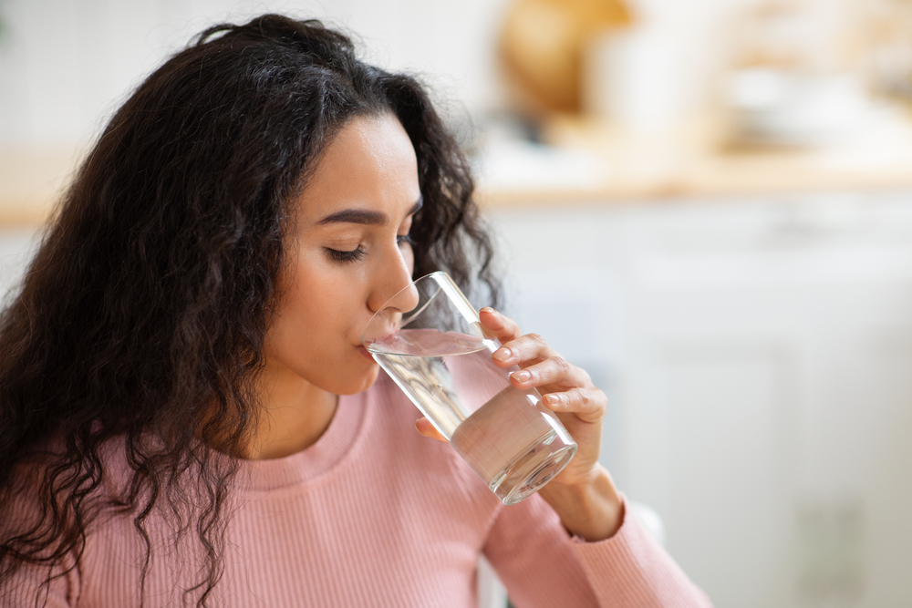 woman drinking glass of water