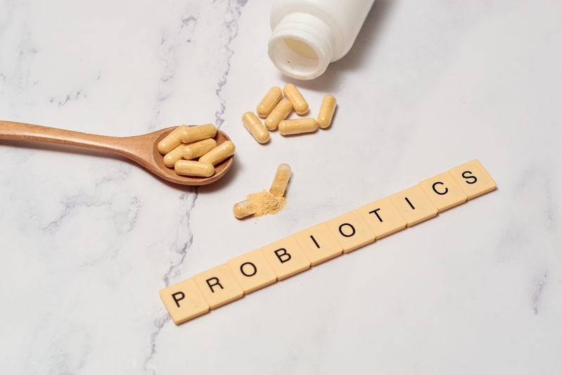 probiotic supplements and letter tiles that spell out "PROBIOTICS"