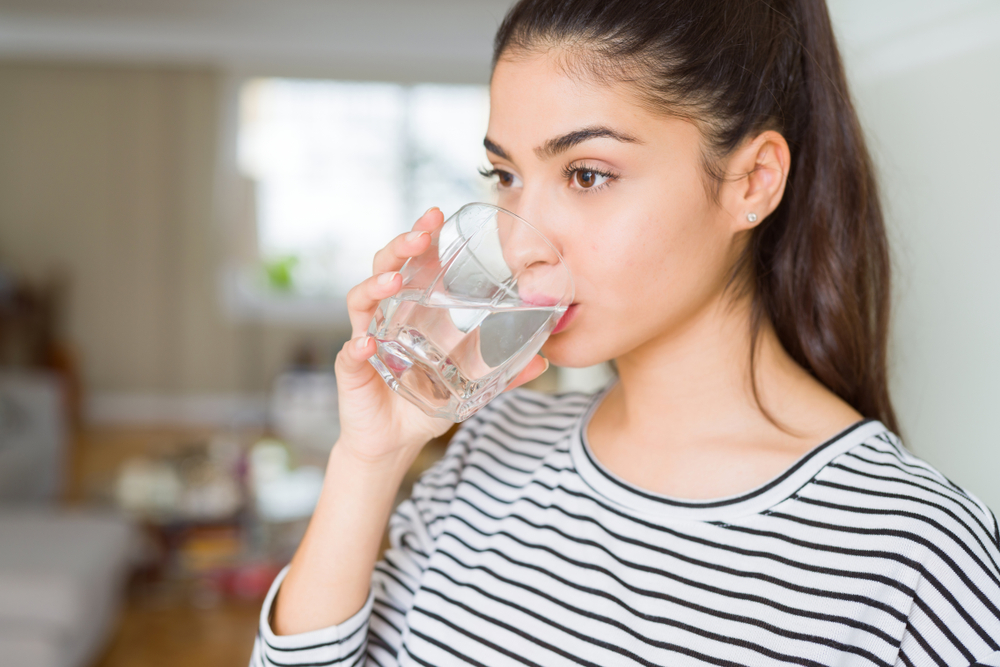 woman drinking glass of water